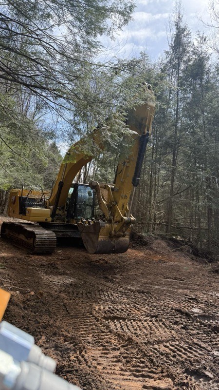 Dump truck hauling material from excavation site in Fulton NY