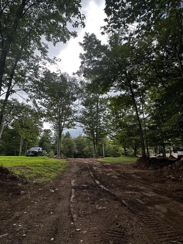 Heavy equipment fleet including excavators and dump trucks ready for project