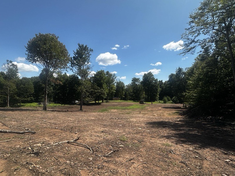 Rip rap and headwall installation at stream crossing in Oswego County