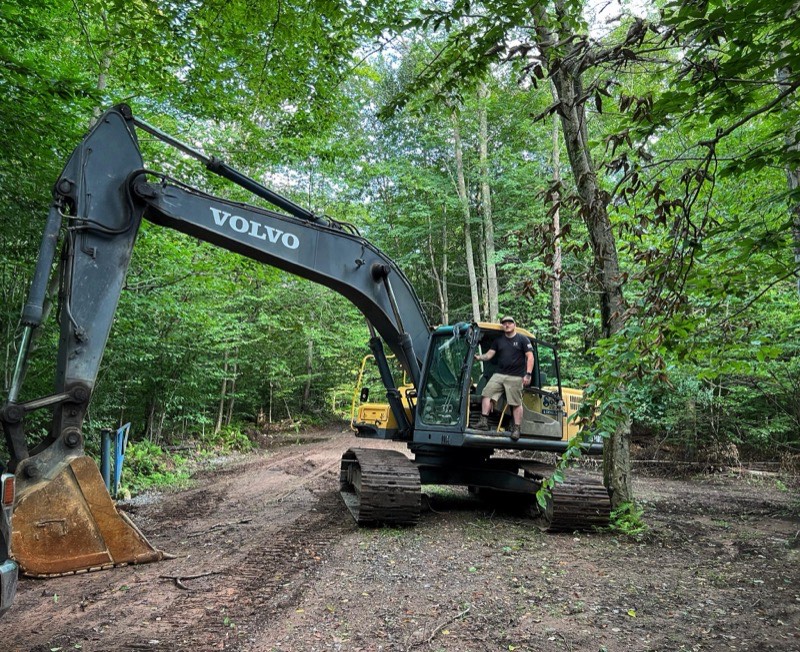 Fine grading for building pad preparation on commercial construction site