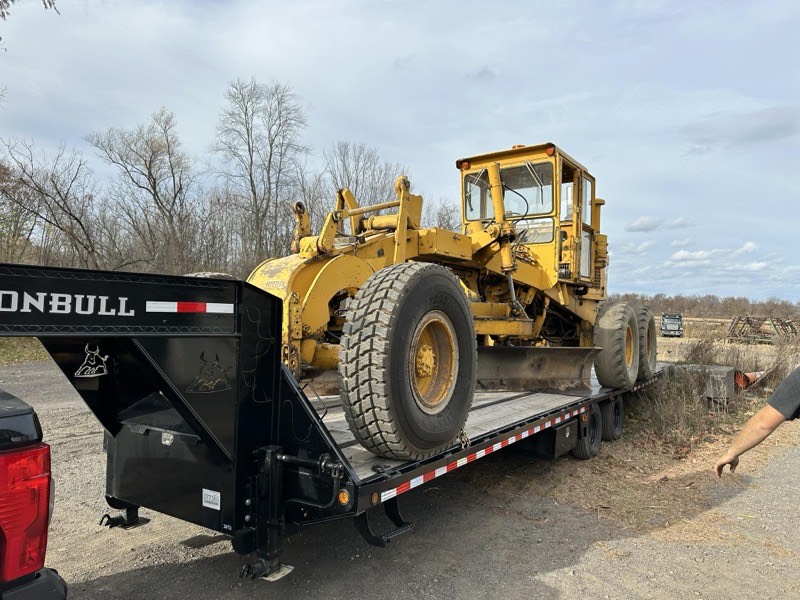 Dozer pushing topsoil during site stripping for construction project