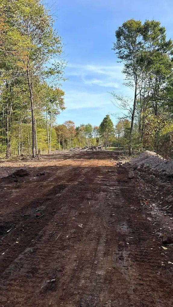 Dump truck delivering septic stone